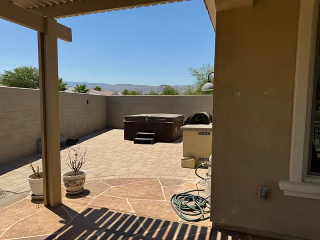 a view of a backyard with sitting area