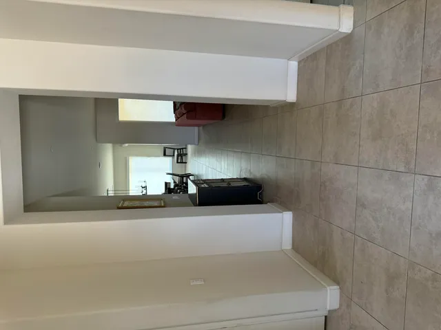 a utility room with closet and window