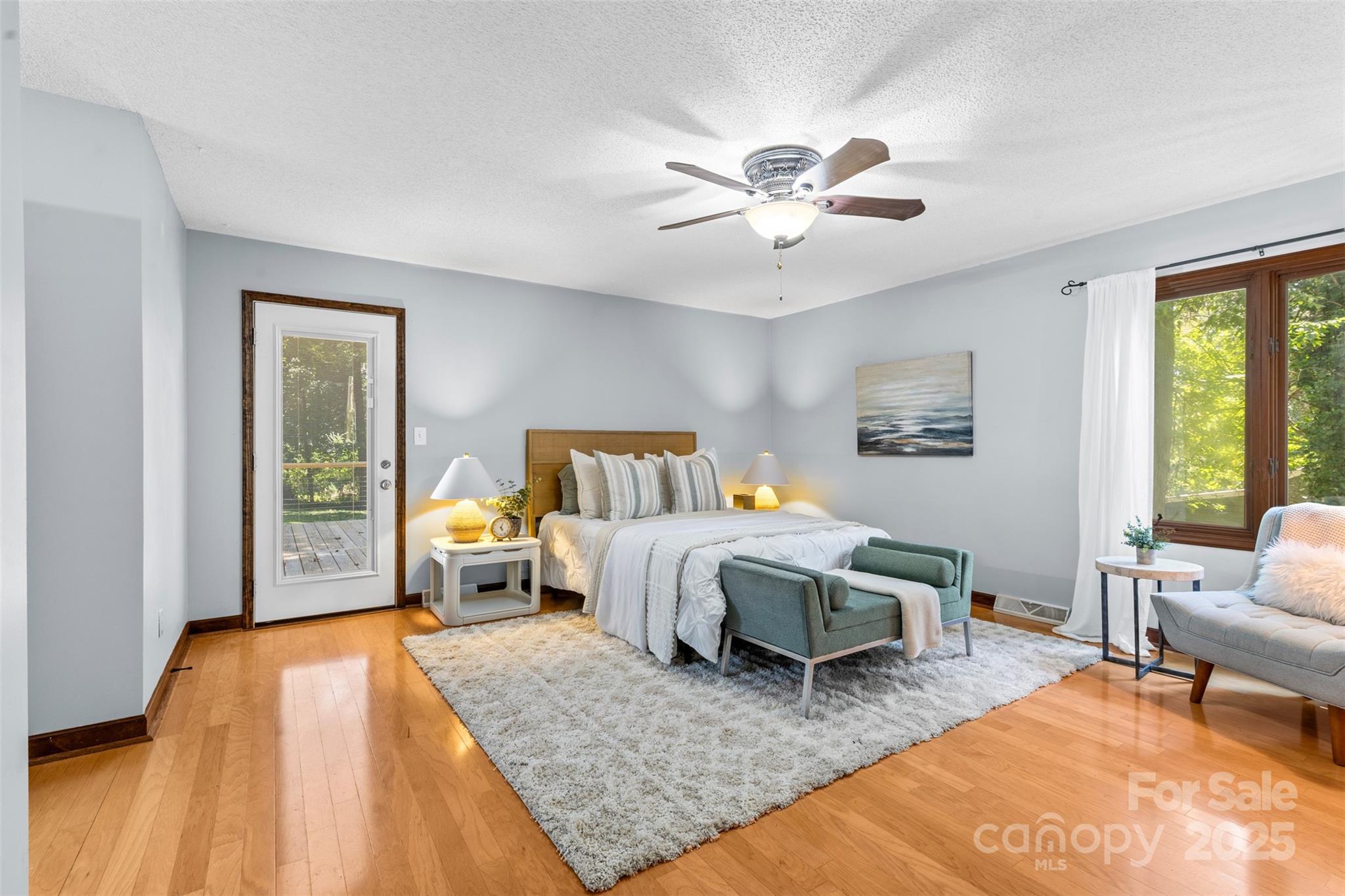 14024 Springwater Drive Matthews, NC 28105 - Photo 17 of 36 a bedroom with a bed a chandelier and a window