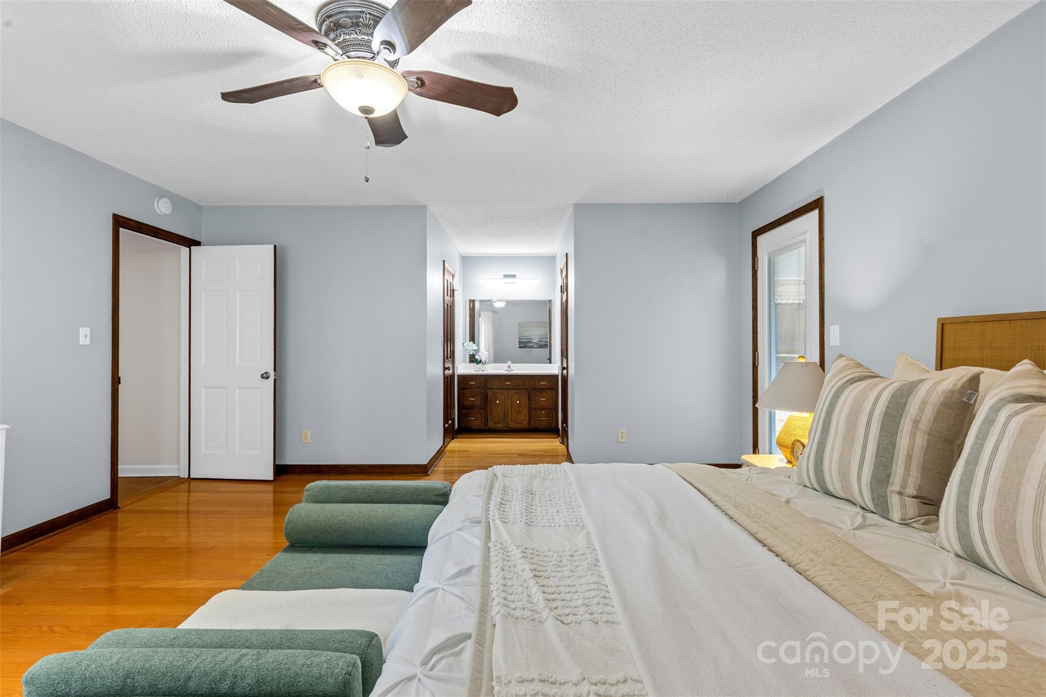 14024 Springwater Drive Matthews, NC 28105 - Photo 21 of 36 a bedroom with a bed ceiling fan and a window