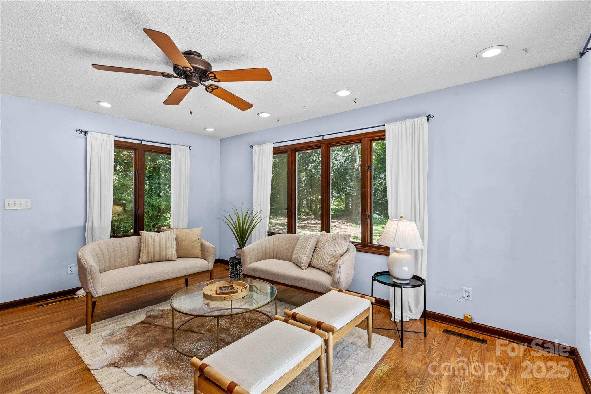 14024 Springwater Drive Matthews, NC 28105 - Photo 24 of 36 a living room with furniture and a large window