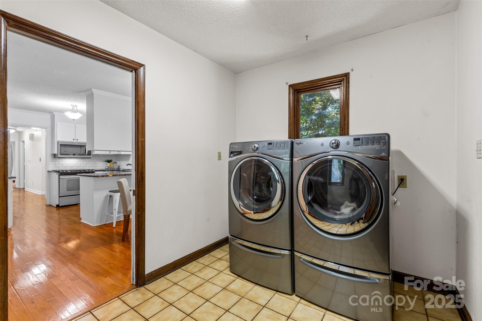 14024 Springwater Drive Matthews, NC 28105 - Photo 27 of 36 a view of a storage & utility room with washer and dryer