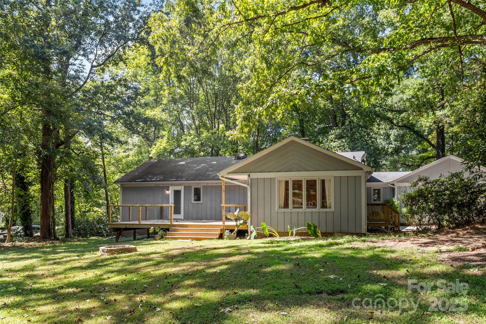 14024 Springwater Drive Matthews, NC 28105 - Photo 28 of 36 a front view of a house with a garden