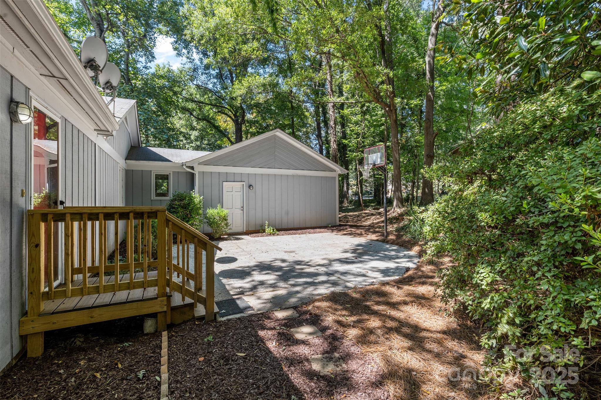 14024 Springwater Drive Matthews, NC 28105 - Photo 30 of 36 a house with trees in front of it