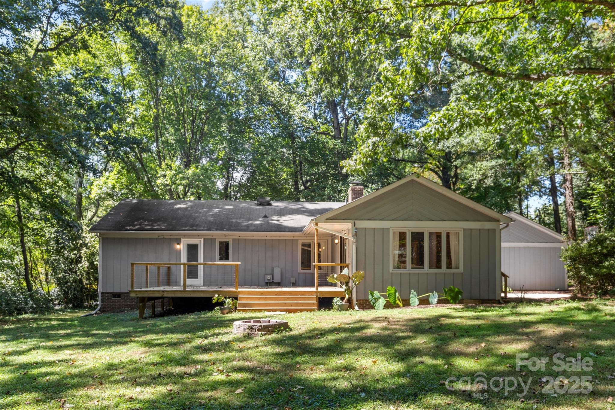 14024 Springwater Drive Matthews, NC 28105 - Photo 35 of 36 a front view of a house with a garden