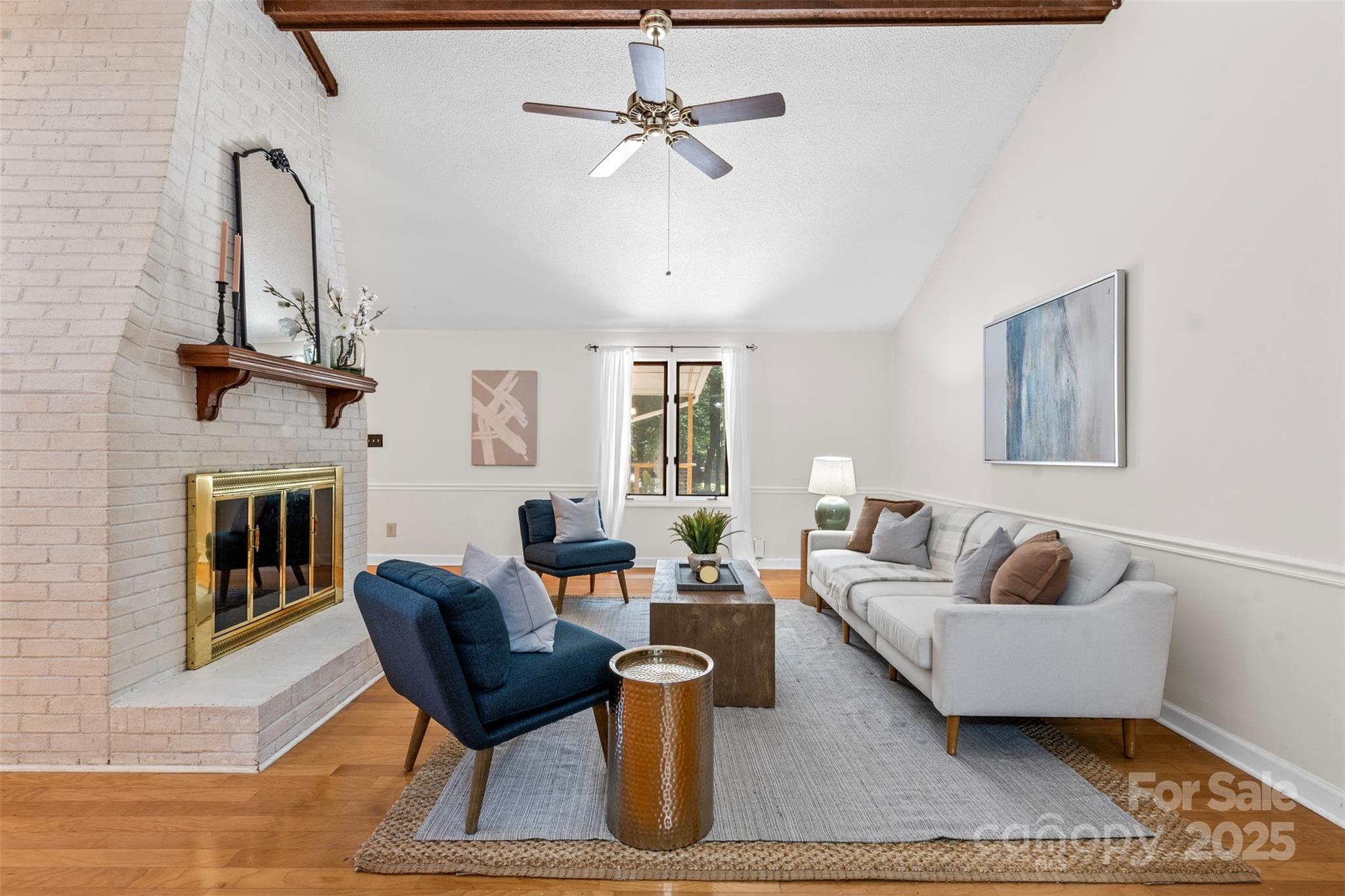 14024 Springwater Drive Matthews, NC 28105 - Photo 5 of 36 a living room with furniture and a fireplace