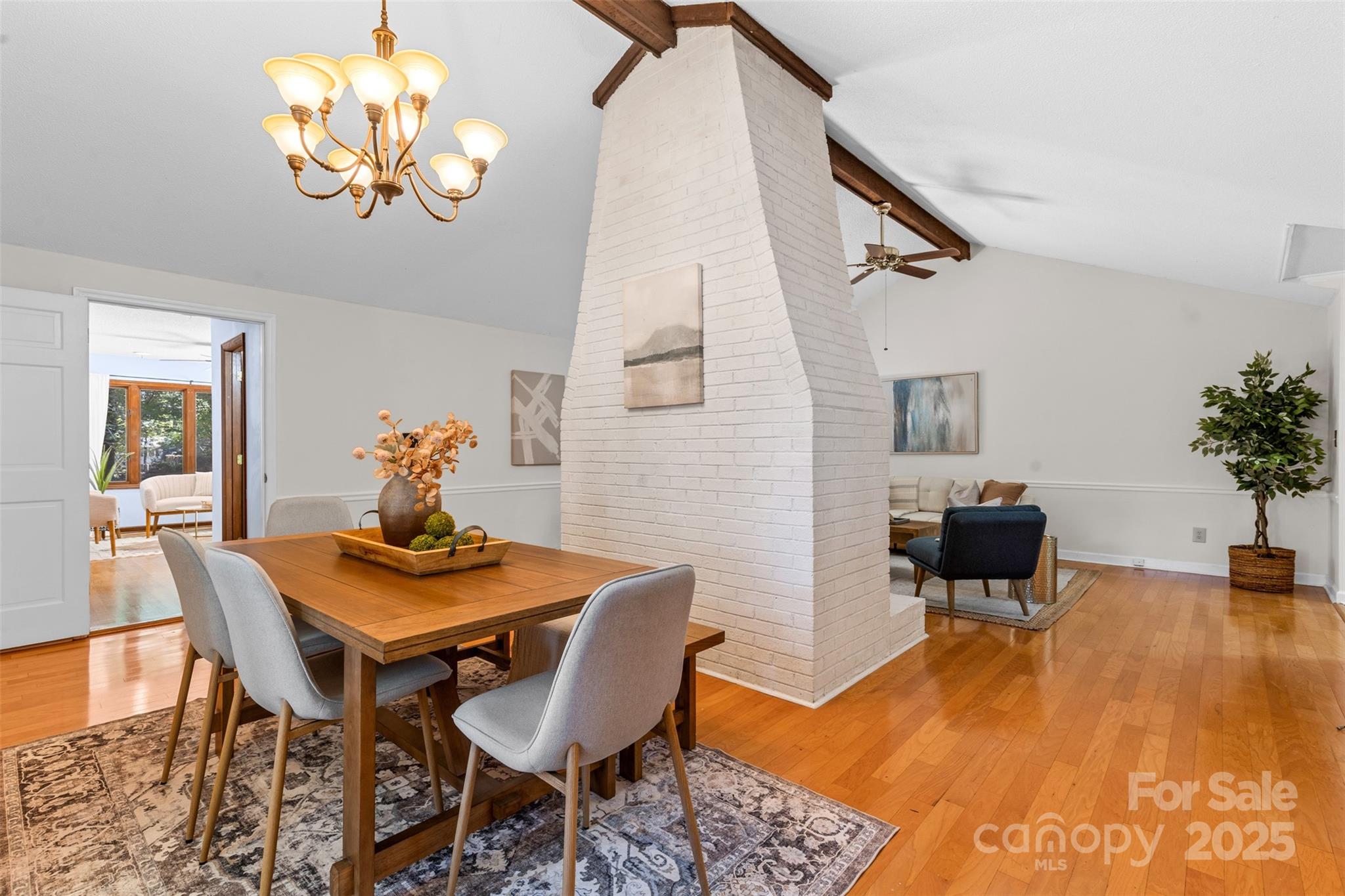 14024 Springwater Drive Matthews, NC 28105 - Photo 6 of 36 a view of a dining room with furniture and wooden floor