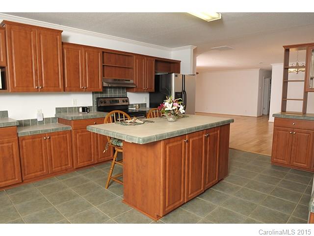 205 Phifer Road Cleveland, NC 27013 - Photo 4 of 17 a kitchen with a sink stove and cabinets