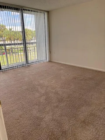 a view of an empty room with a large window