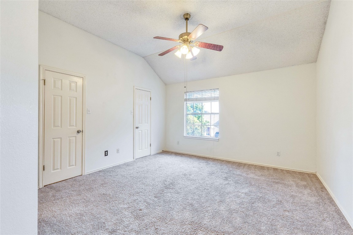 3600 Cheyenne Street Round Rock, TX 78665 - Photo 18 of 36 an empty room with windows and fan