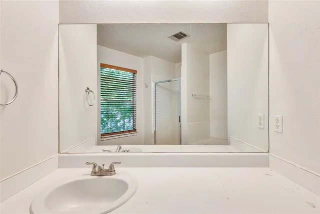 a view of a brick house with an outdoor space