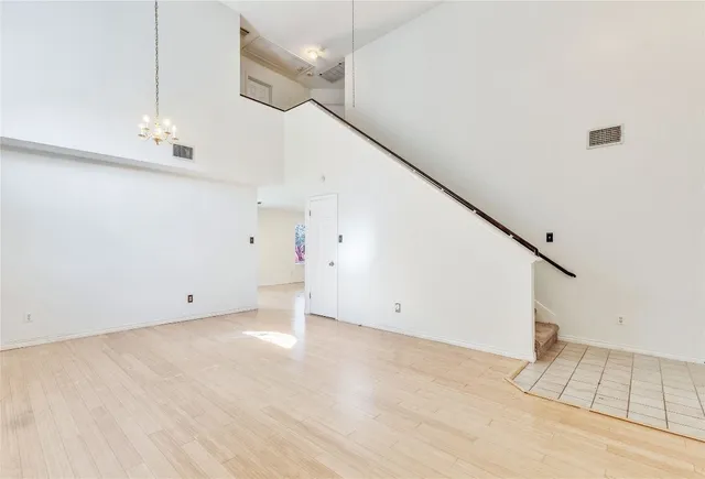 a view of an empty room with stairs