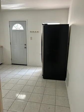 a view of a refrigerator in a kitchen