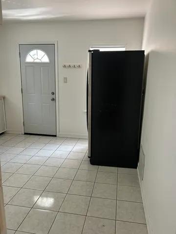 a view of a refrigerator in a kitchen