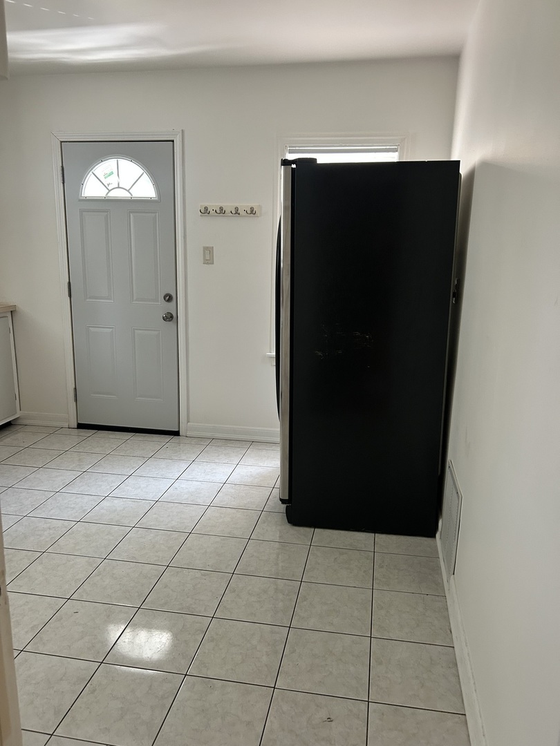 21149 Main Street Matteson, IL 60443 - Photo 4 of 11 a view of a refrigerator in a kitchen