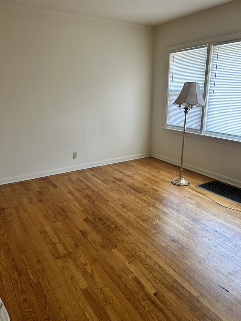21149 Main Street Matteson, IL 60443 - Photo 5 of 11 a view of an empty room and wooden floor
