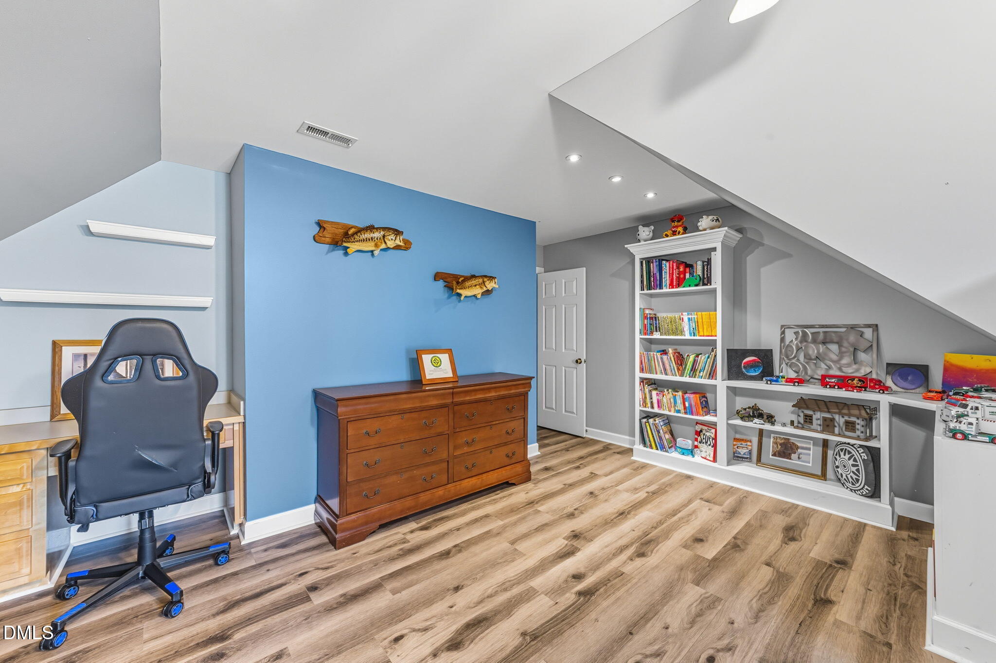 1617 Kendall Hill Road Willow Spring, NC 27592 - Photo 49 of 58 a room with furniture and wooden floor