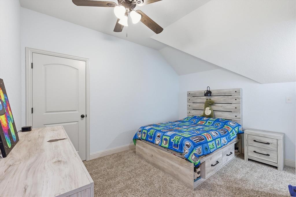 1105 Safrano Street Midlothian, TX 76065 - Photo 17 of 25 a bedroom with a bed and a baby crib