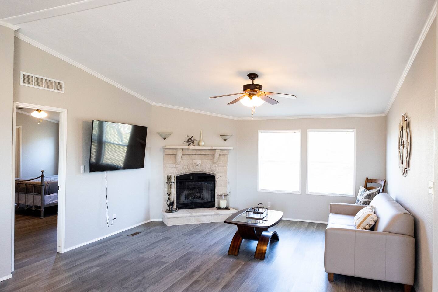 1901 Harmon Hills Road Dripping Springs, TX 78620 - Photo 20 of 27 a living room with furniture fireplace and window