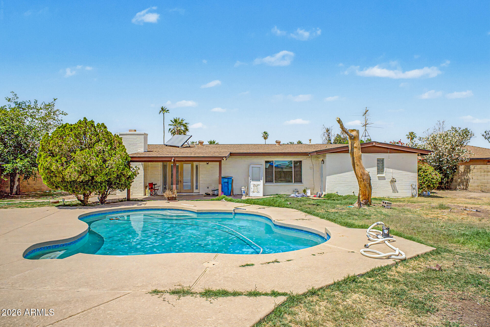 4007 West Mountain View Road Phoenix, AZ 85051 - Photo 28 of 31 a view of a house with a yard porch and sitting area