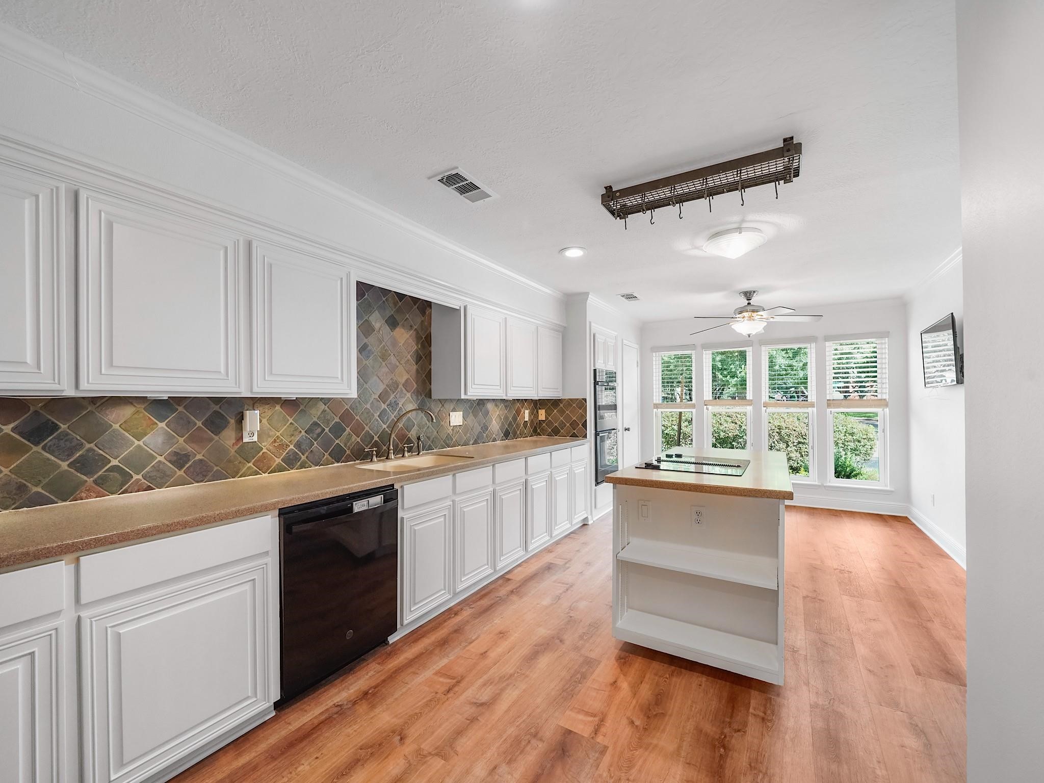 910 Enclave Parkway Houston, TX 77077 - Photo 13 of 42 Deep pantry and cabinet space maximize functionality for everyday living.