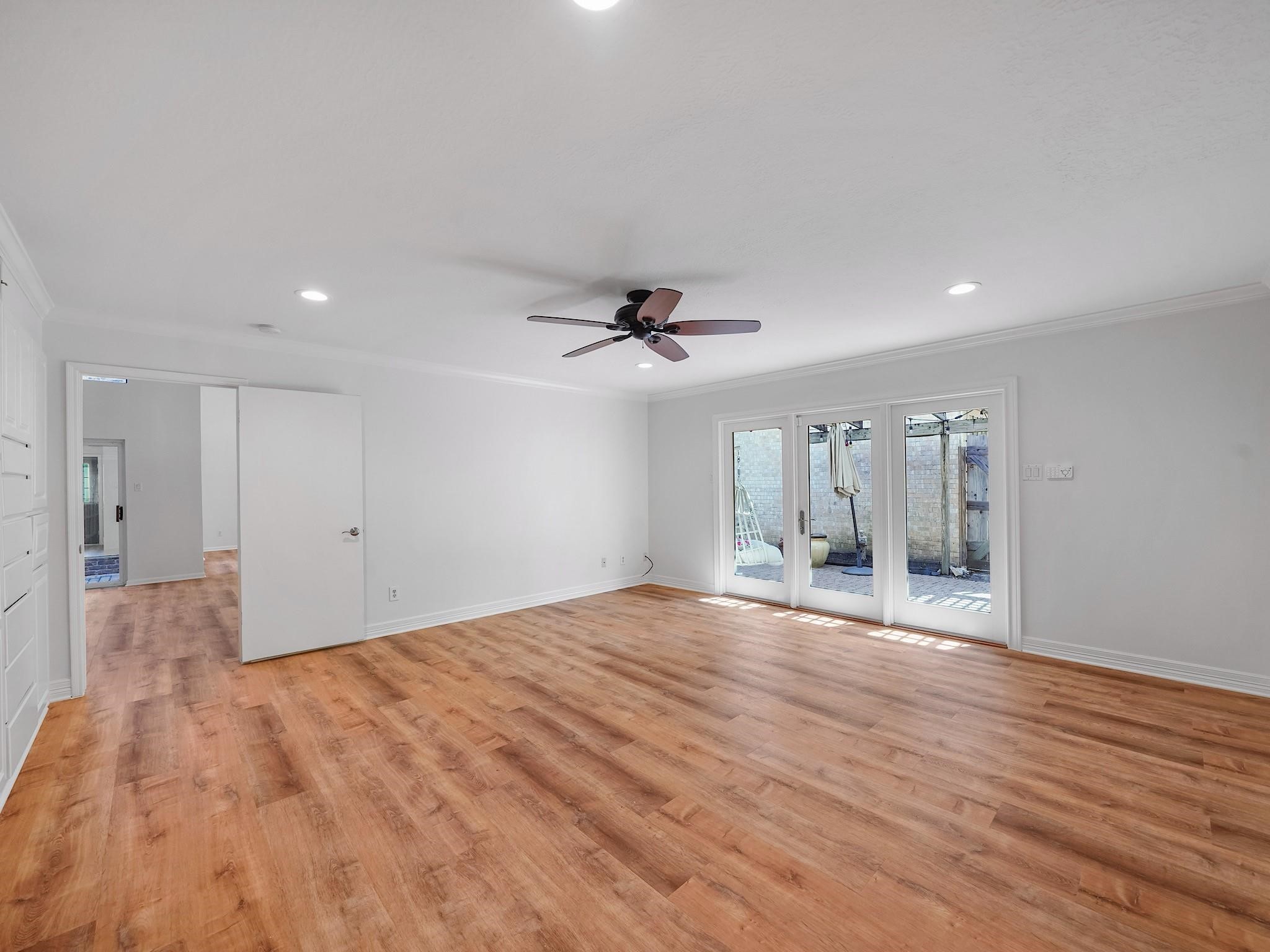 910 Enclave Parkway Houston, TX 77077 - Photo 17 of 42 Extra-large first-floor retreat with durable vinyl wood flooring and room for a sitting area.