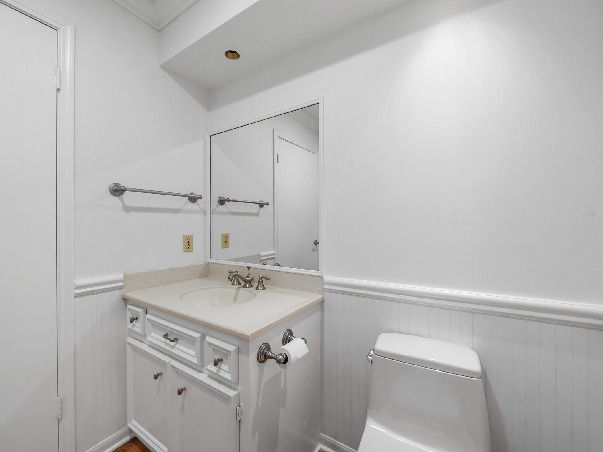 910 Enclave Parkway Houston, TX 77077 - Photo 23 of 42 A half bathroom conveniently located by the kitchen, living room and dining room.