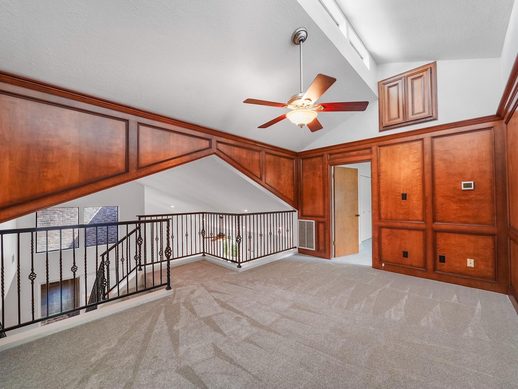 910 Enclave Parkway Houston, TX 77077 - Photo 27 of 42 Cozy loft-style den—ideal for media, study, or play space.