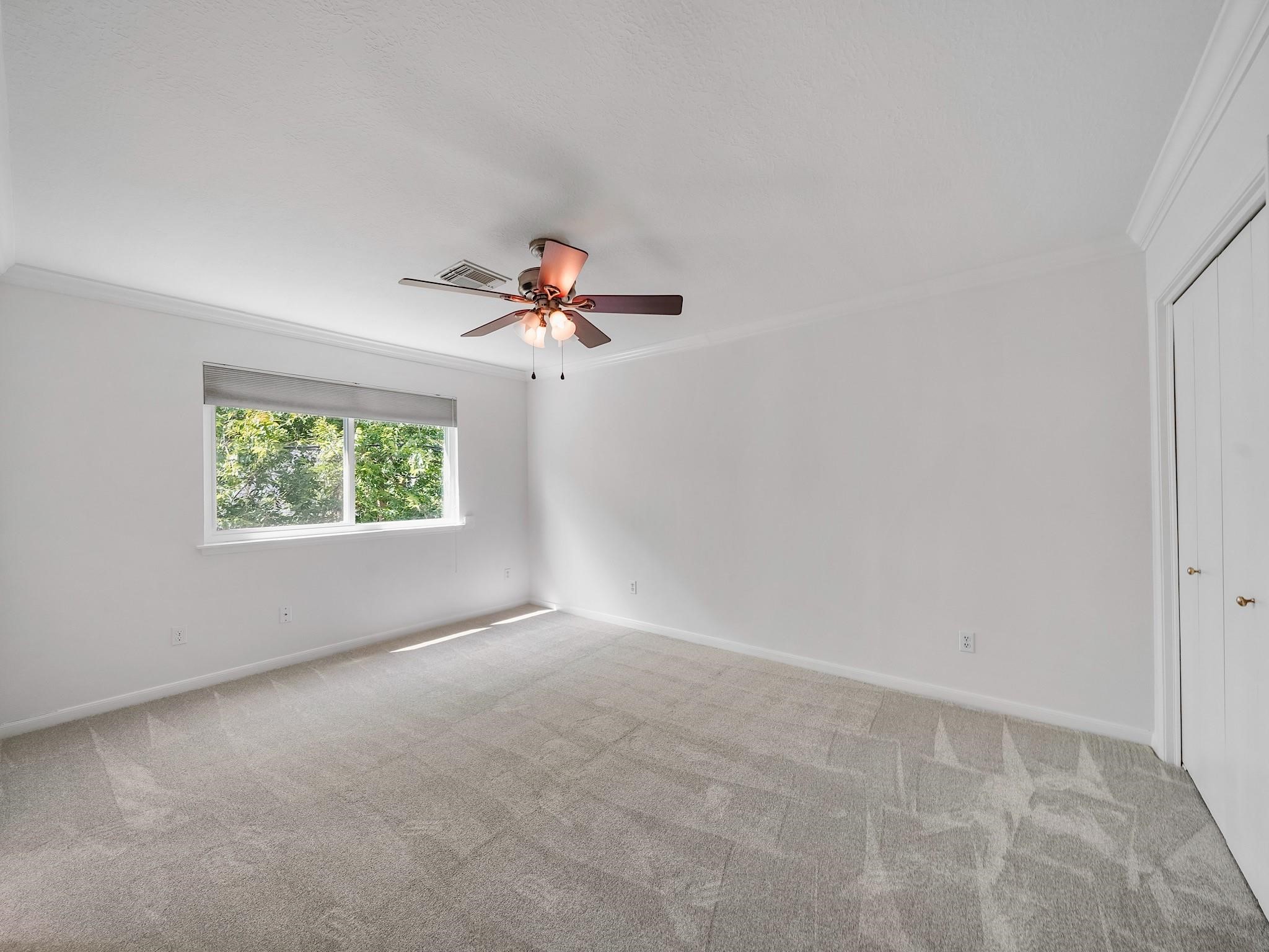 910 Enclave Parkway Houston, TX 77077 - Photo 29 of 42 Upstairs bedroom with fresh new carpet and ample closet space.