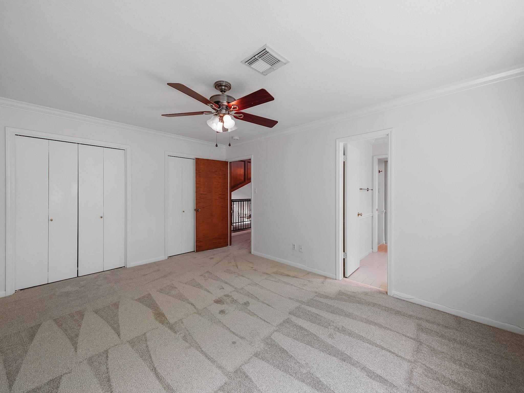 910 Enclave Parkway Houston, TX 77077 - Photo 30 of 42 Spacious secondary bedroom with fresh carpet and great closet space.