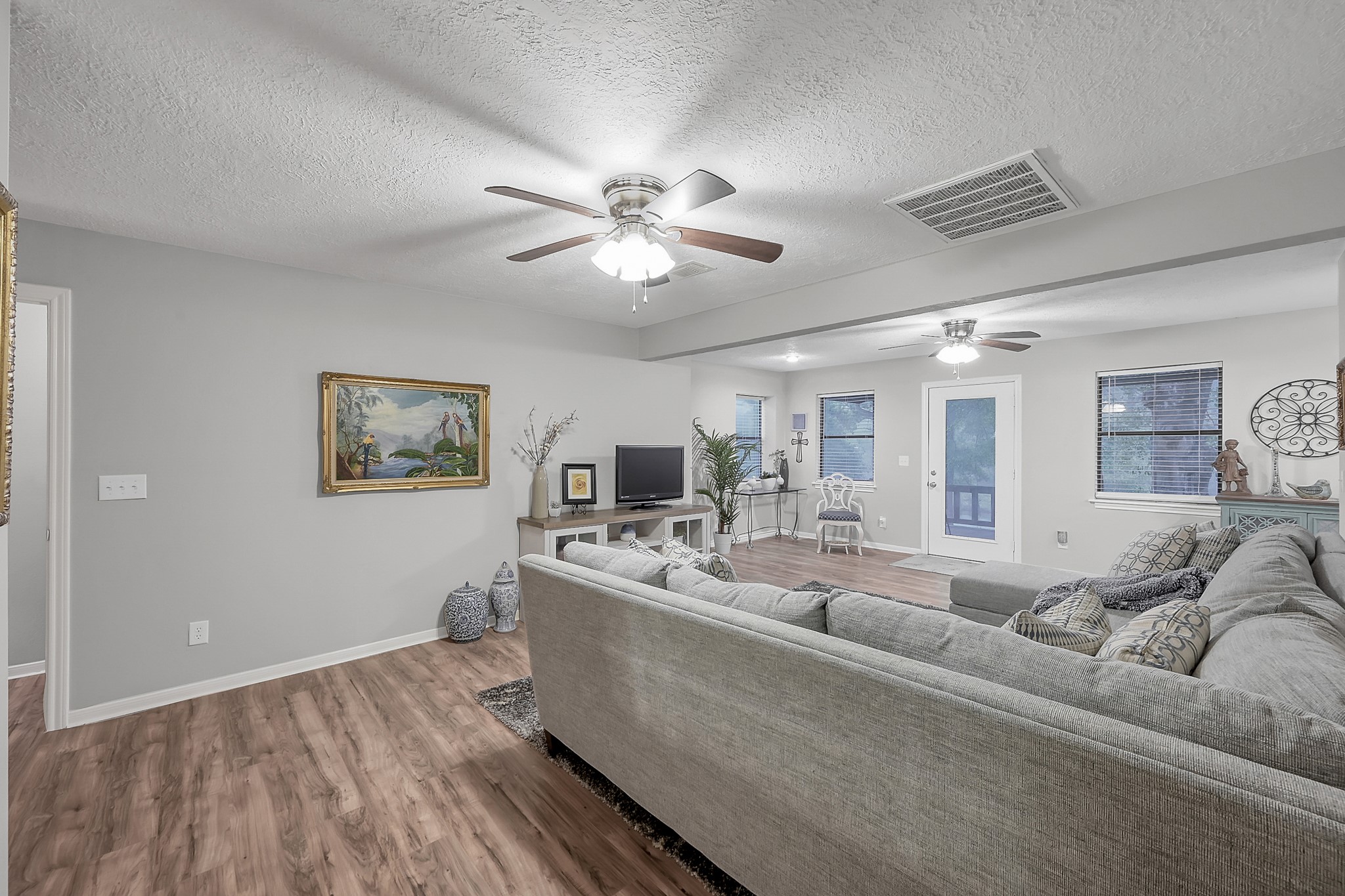 80 Nettie Phillips Road Coldspring, TX 77331 - Photo 22 of 49 Upstairs Living Area with access to generous balcony through the single exterior door. Don't miss those views.