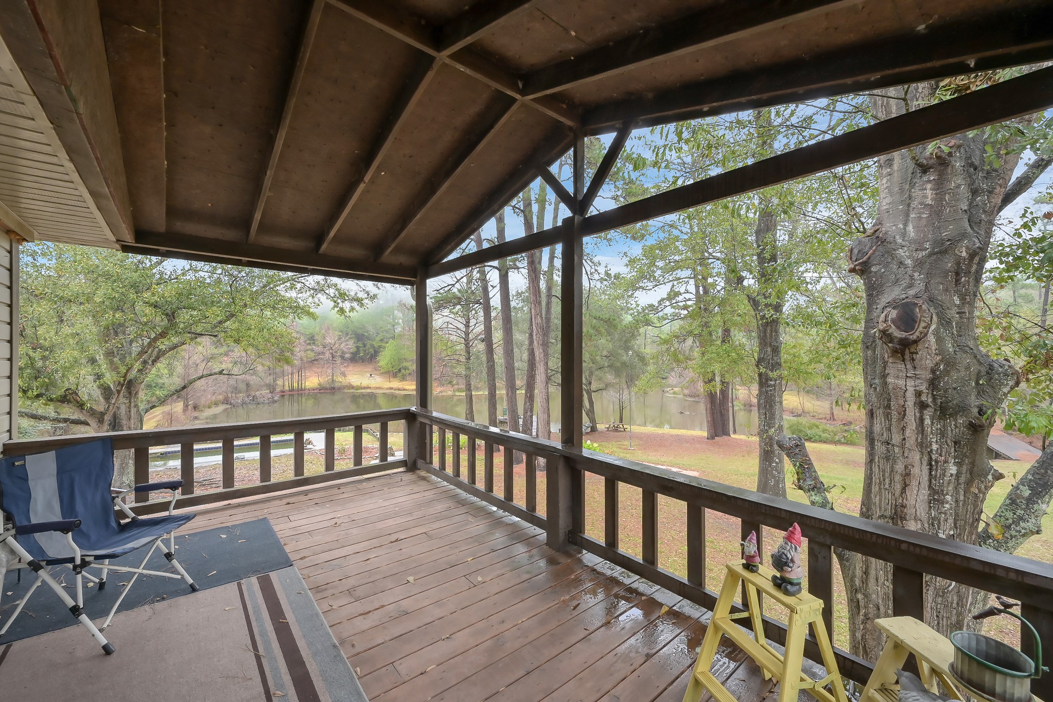 80 Nettie Phillips Road Coldspring, TX 77331 - Photo 23 of 49 Upstairs Balcony out the door from the Living Room....what a spectacular view!