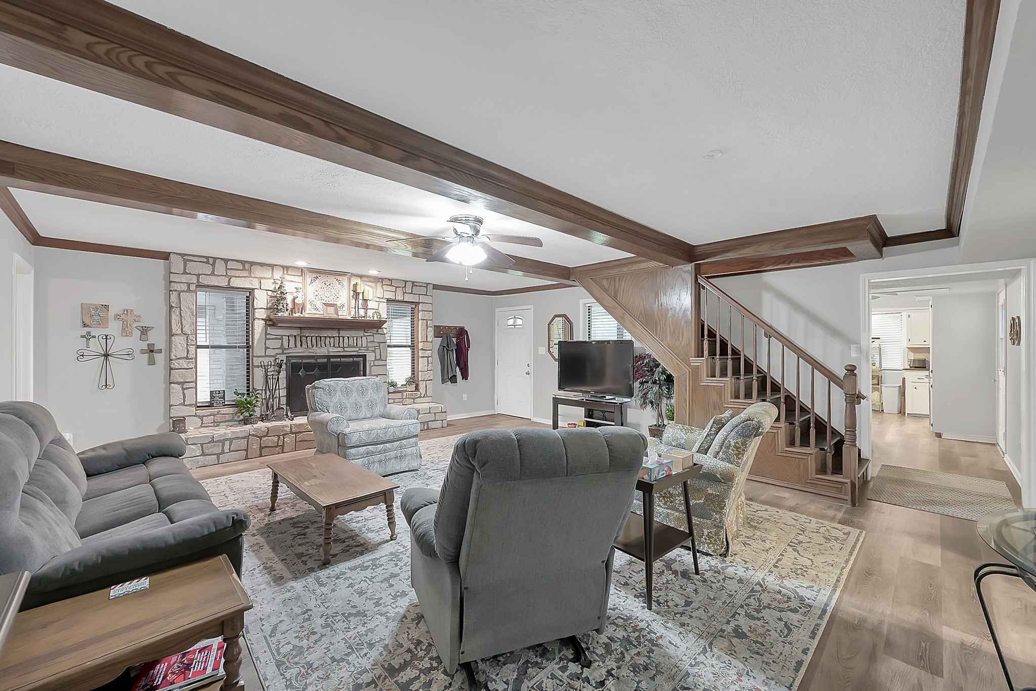 80 Nettie Phillips Road Coldspring, TX 77331 - Photo 8 of 49 Complimentary view of the Living Area with access to the Kitchen just past the stairwell on your right.
