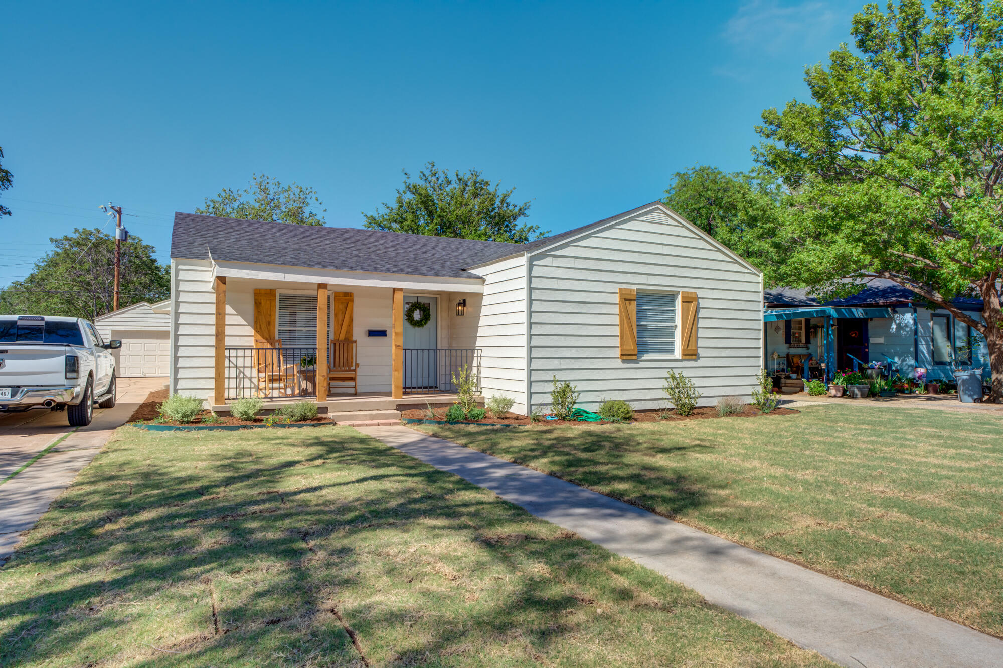 3610 30th Street Lubbock, TX 79410 - Photo 1 of 35 a front view of a house with a garden
