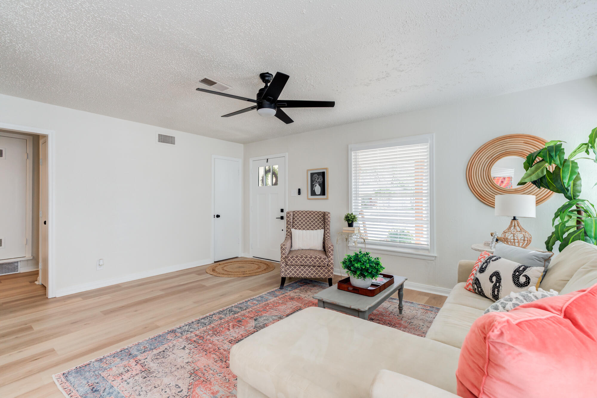 3610 30th Street Lubbock, TX 79410 - Photo 11 of 35 a living room with furniture and a window