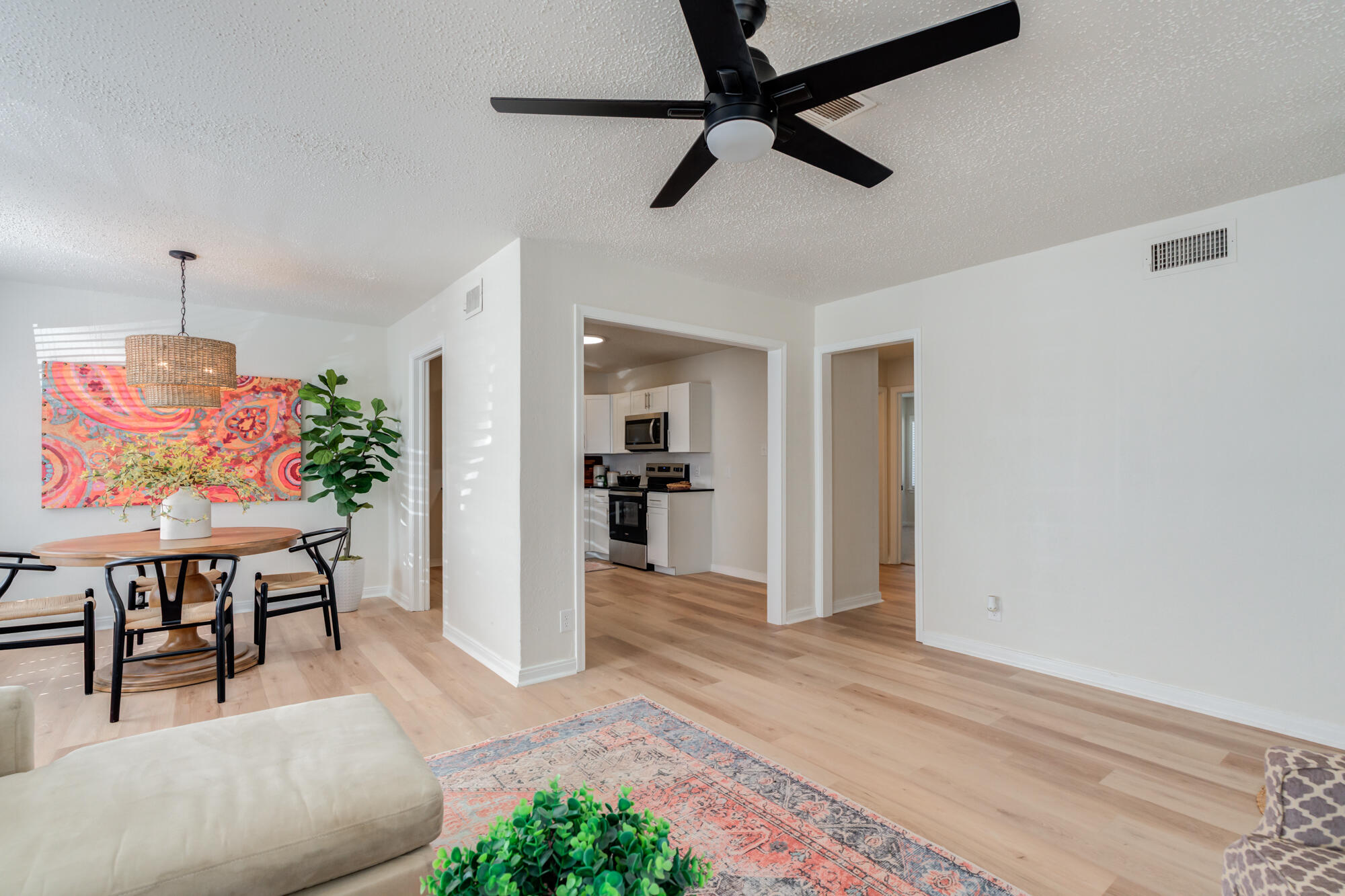 3610 30th Street Lubbock, TX 79410 - Photo 13 of 35 a view of a livingroom with furniture and a ceiling fan