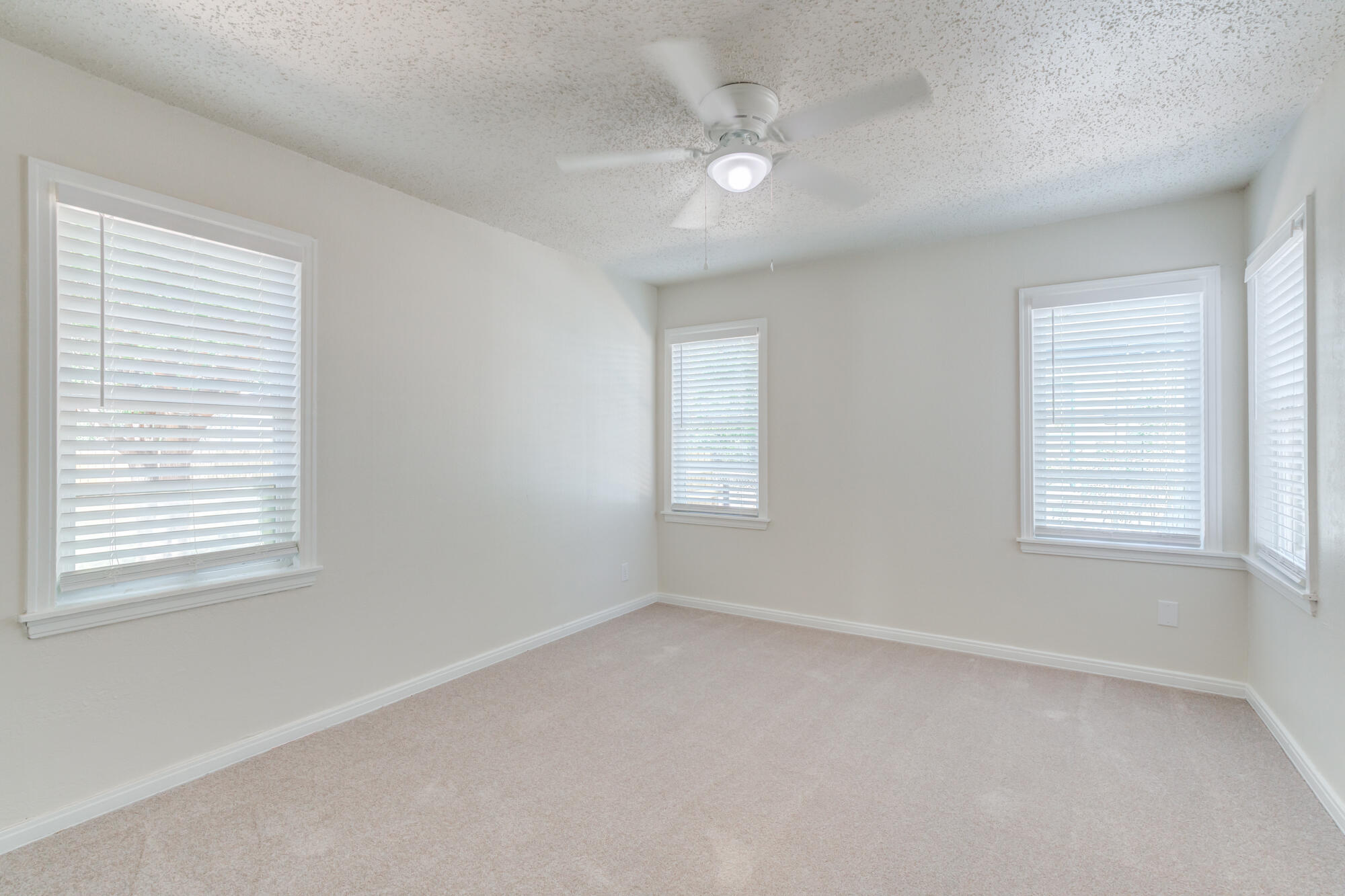 3610 30th Street Lubbock, TX 79410 - Photo 30 of 35 an empty room with a window