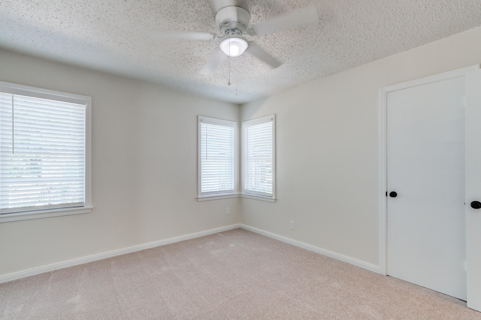3610 30th Street Lubbock, TX 79410 - Photo 31 of 35 a view of an empty room with a window