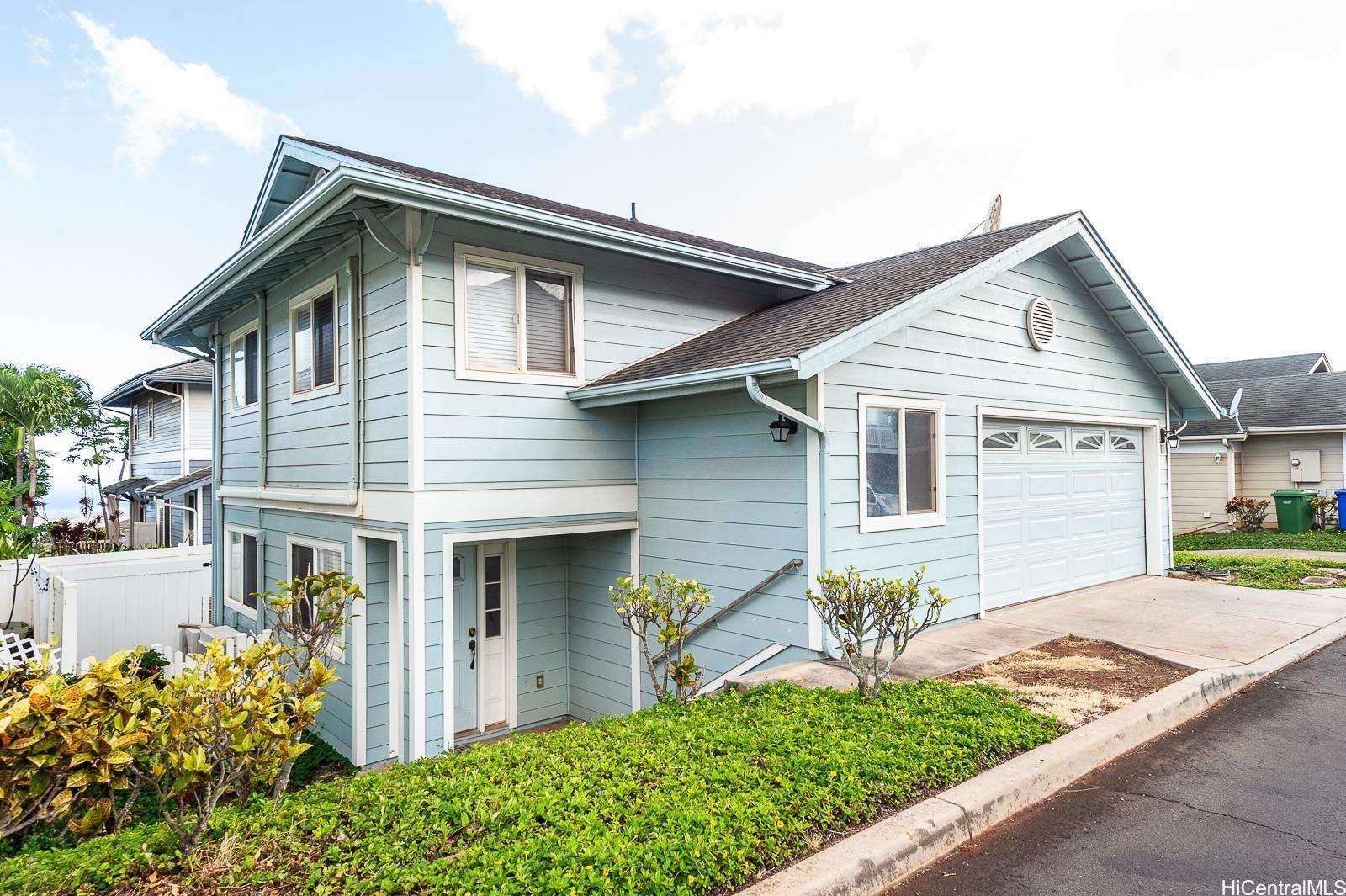 92-7049 Elele Street, Unit 81 Kapolei, HI 96707 - Photo 1 of 21 a front view of a house with garden