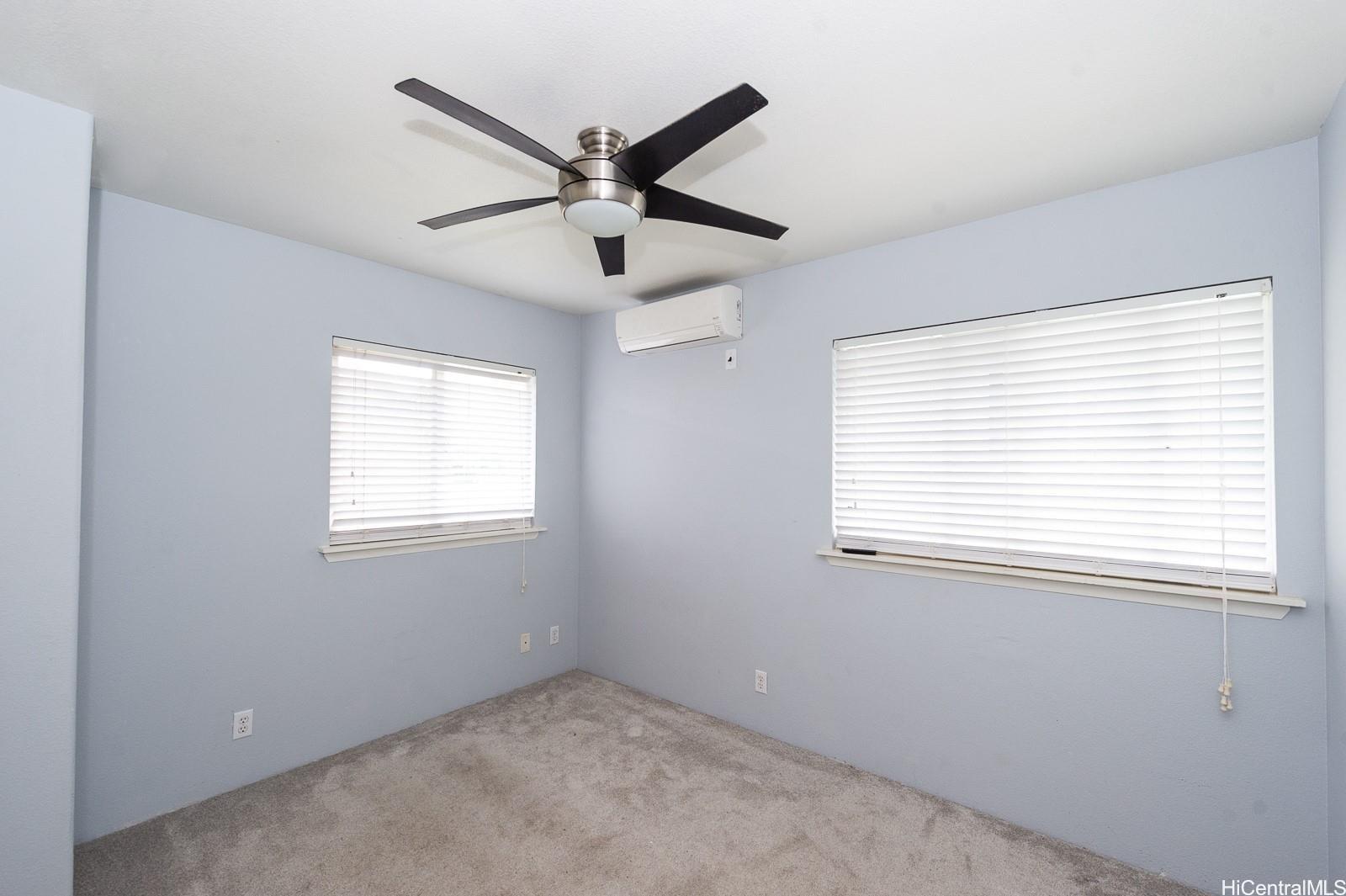 92-7049 Elele Street, Unit 81 Kapolei, HI 96707 - Photo 13 of 21 an empty room with a window and a fan
