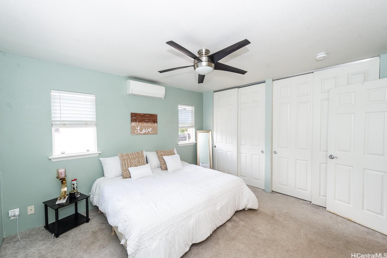 92-7049 Elele Street, Unit 81 Kapolei, HI 96707 - Photo 16 of 21 a bedroom with a bed and a window