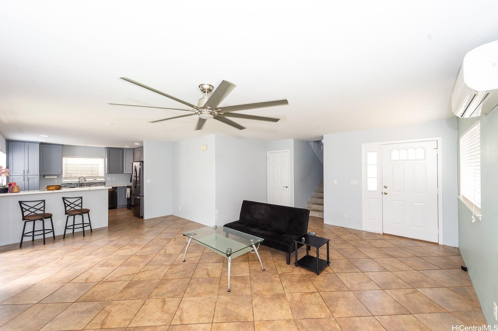 92-7049 Elele Street, Unit 81 Kapolei, HI 96707 - Photo 6 of 21 a living room with a window and a table