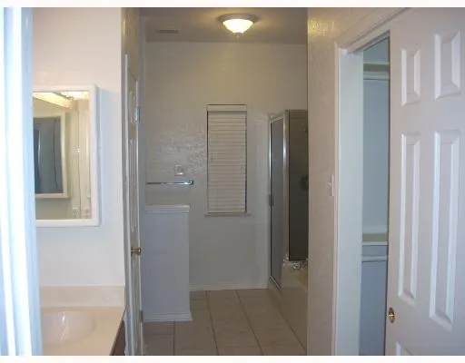 a view of a bathroom from a hallway