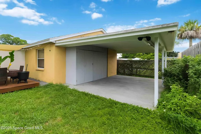 a view of an chairs and table in the patio