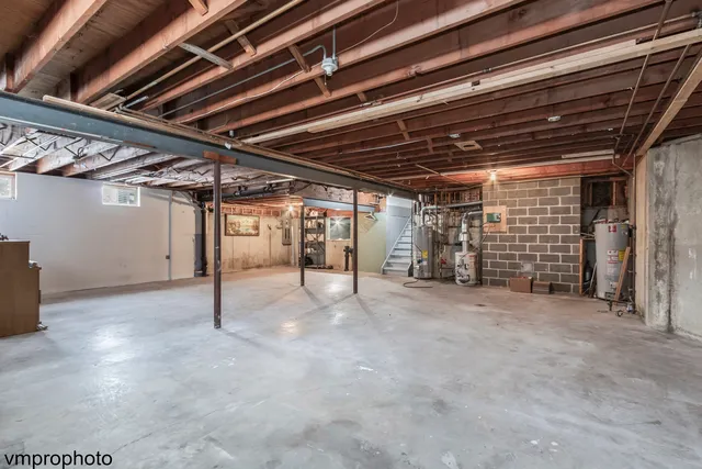 a view of empty room with wooden ceiling