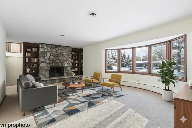 a living room with furniture large window and outer view