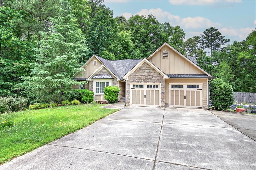 561 Holland Road Dallas, GA 30157 - Photo 2 of 48 a view of a house with a yard