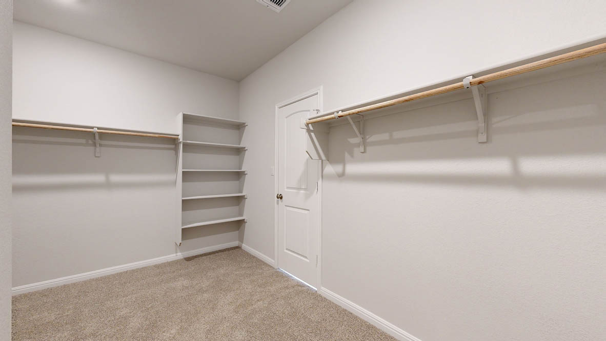 808 Gauge Road Thorndale, TX 76577 - Photo 15 of 31 Ample storage solutions await in this well-appointed closet, featuring built-in shelving and convenient hanging rods.