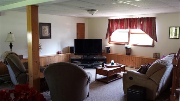 117 Mohawk Drive Seekonk, MA 02771 - Photo 11 of 16 a living room with furniture a flat screen tv and a window