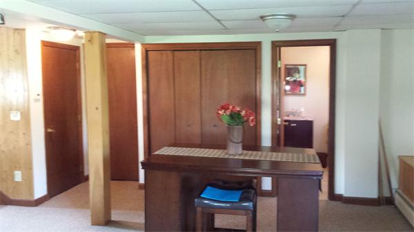 117 Mohawk Drive Seekonk, MA 02771 - Photo 14 of 16 a room with a table and a potted plant